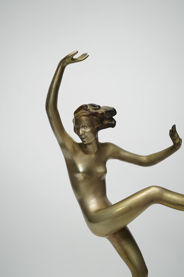 In the manner of Josef Lorenzl, an Art Deco bronze figure of a dancer on onyx base, 29cm. Condition - fair to good